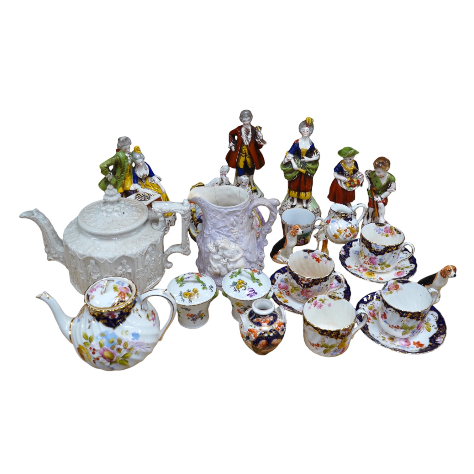 A quantity of 19th and early 20th century ceramics including two chess playing groups, four further Continental figures, a copy of a Meigh teapot, three cups and saucers, two Meissen pots and covers, etc. Condition - var